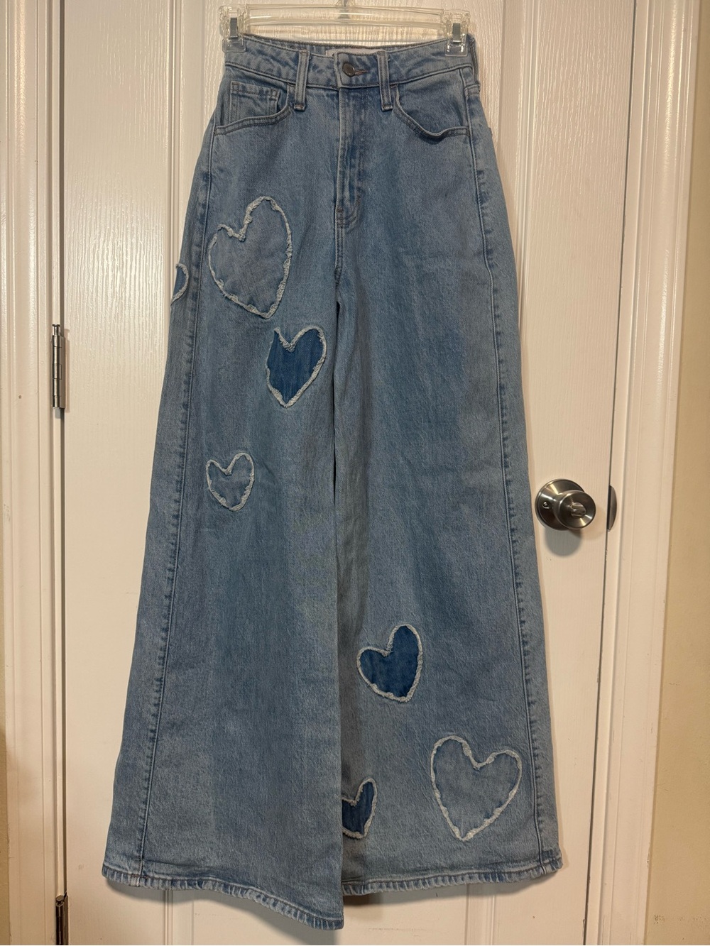 High-Rise Light Blue Wide-Leg Jeans with Heart Patch Details